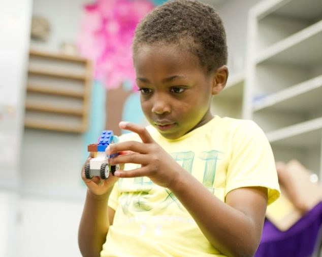 Boy playing with legos