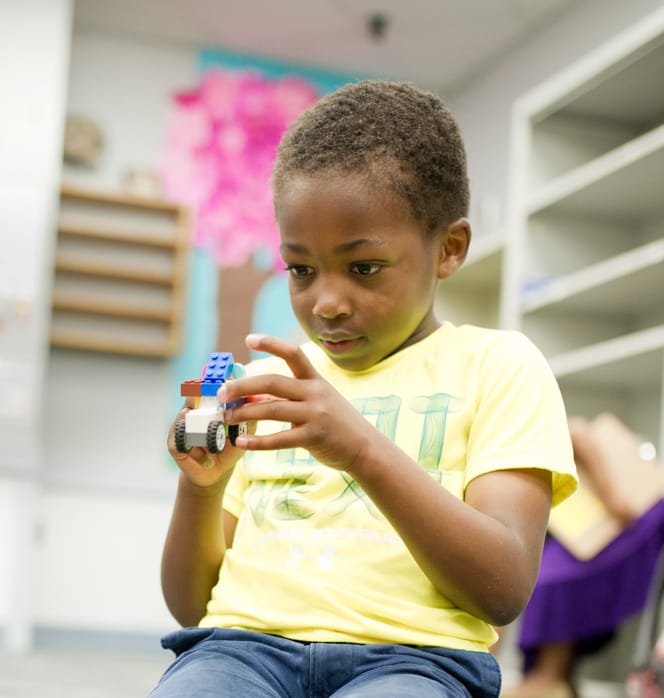 Boy playing with legos