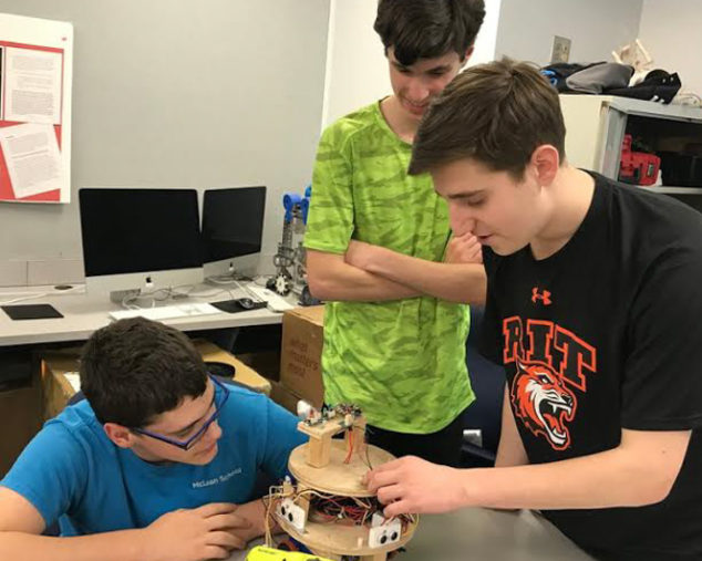 Boys at the STEM program working on a project