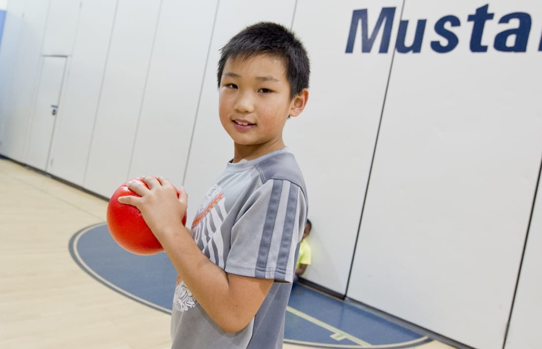 Boy playing dodgeball