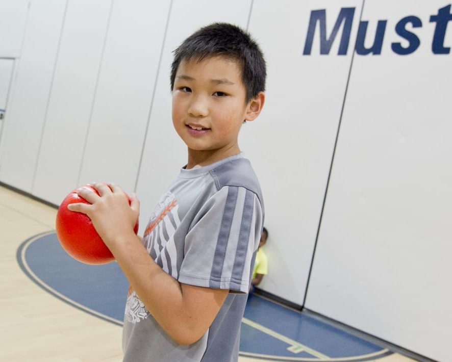 Boy playing dodgeball