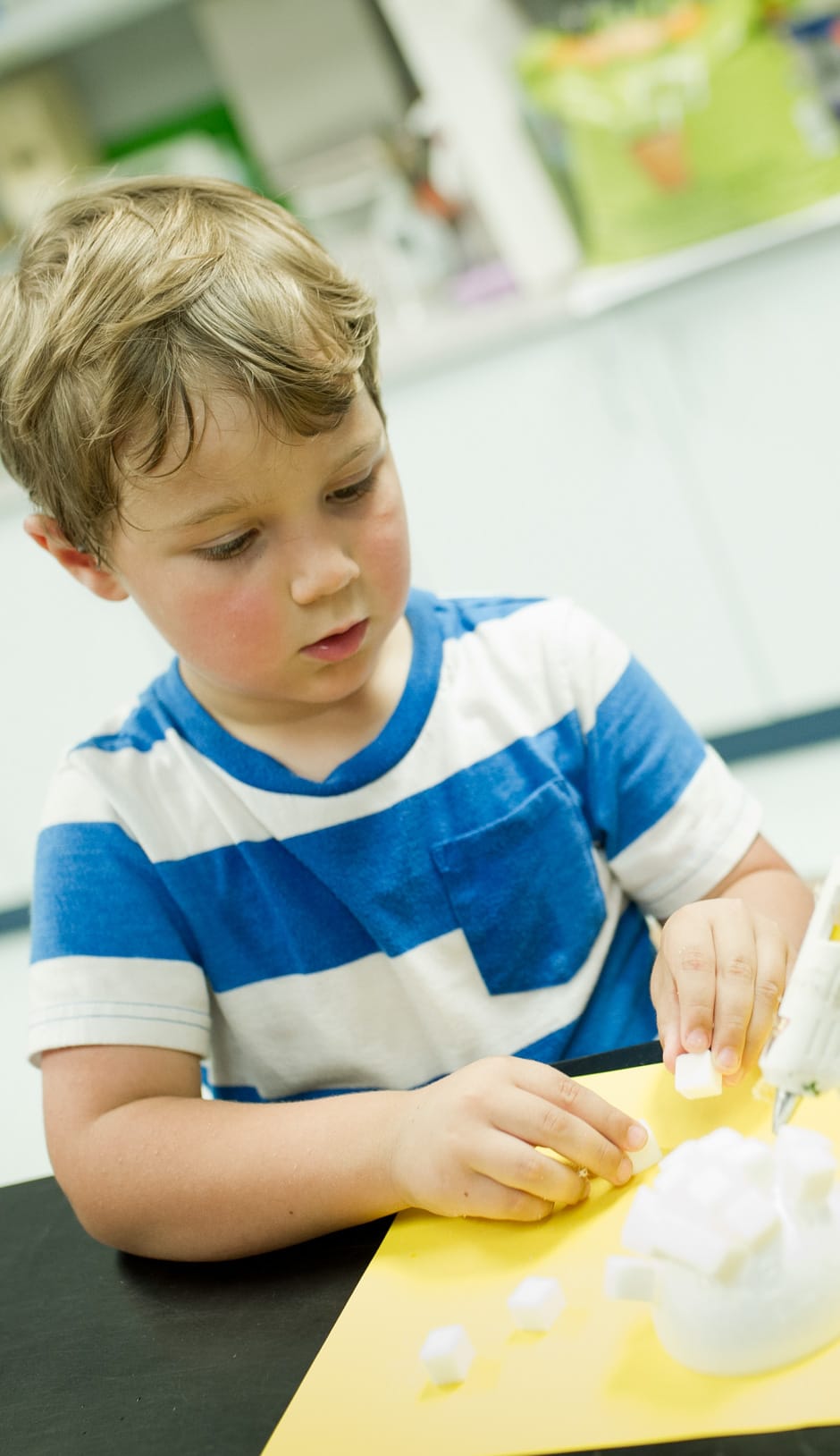 Young boy making an art project