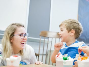 Staff and young boy at Learning Leaps program