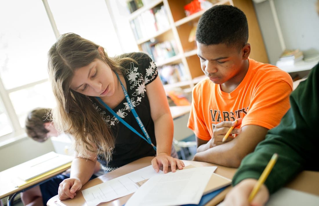 Staff helping a student at reading