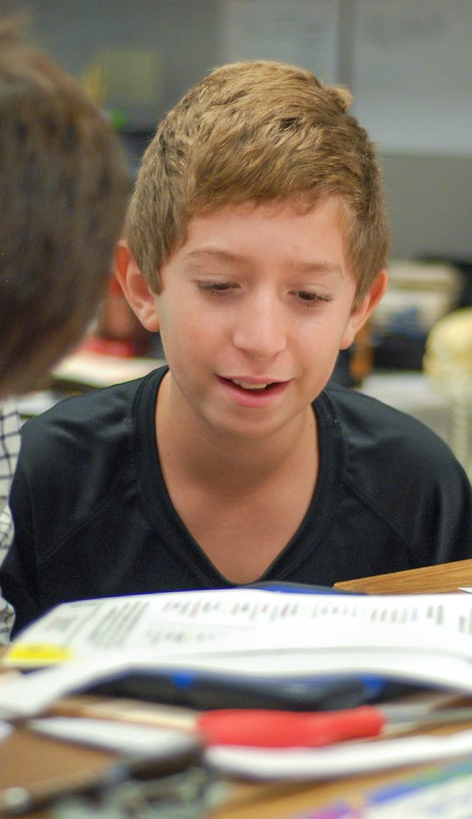 Middle school student practicing his writing