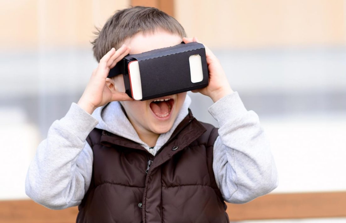 Boy using a virtual reality device