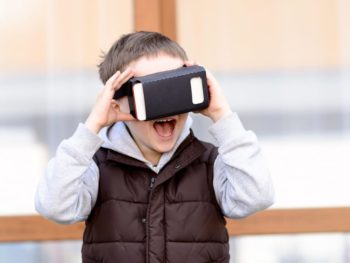 Boy using a virtual reality device