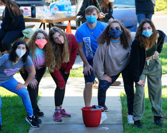 Kids with masks outside