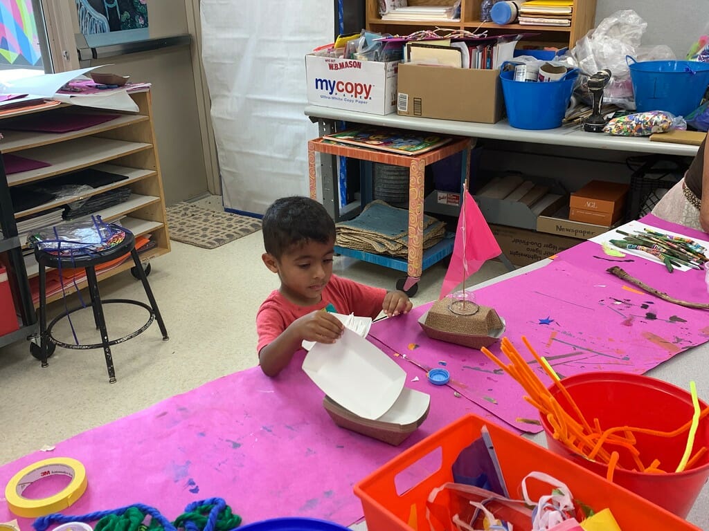 A student making a sailboat.